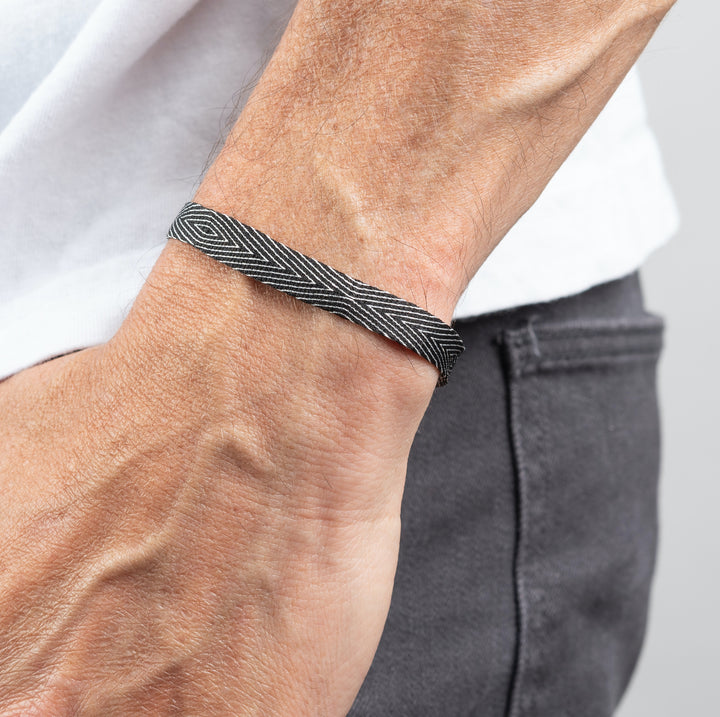 Handwoven Egyptian Loom Black and White Surfer Bracelet on wrist