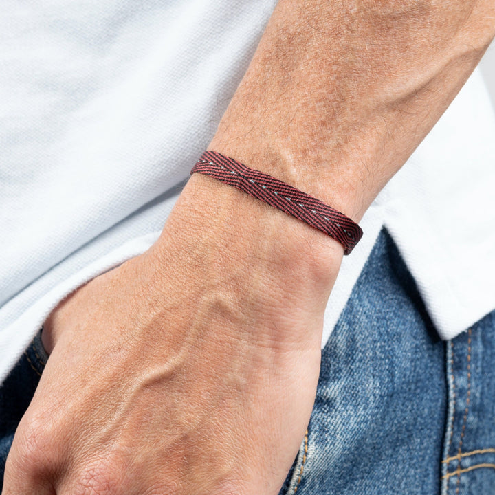 Handwoven Egyptian Loom Red and Black Surfer Bracelet on wrist