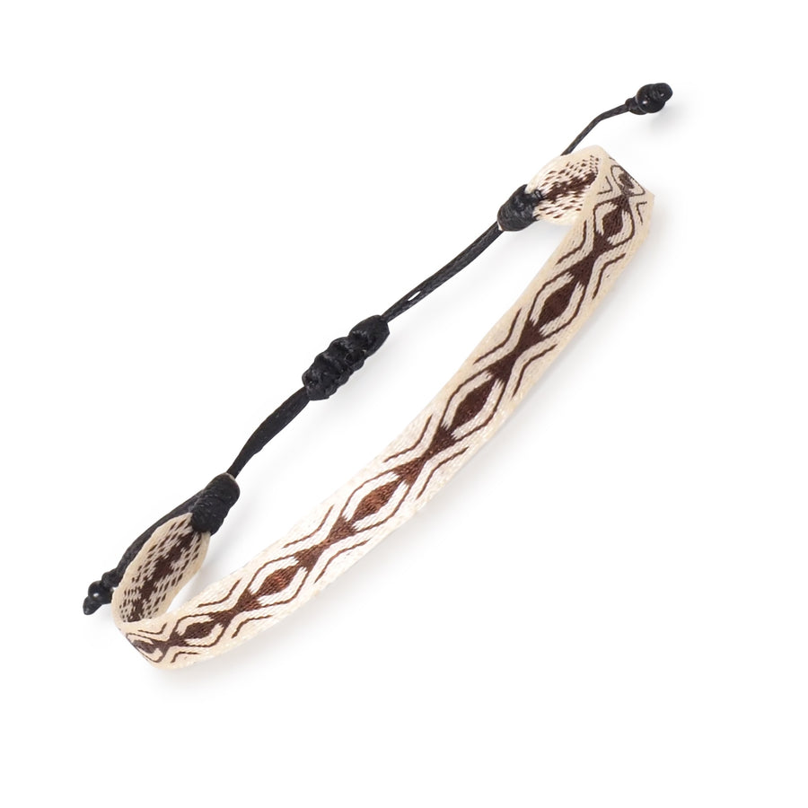 Handwoven beige and brown boho style surfer bracelet with geometric pattern; adjustable and handmade in Colombia.










