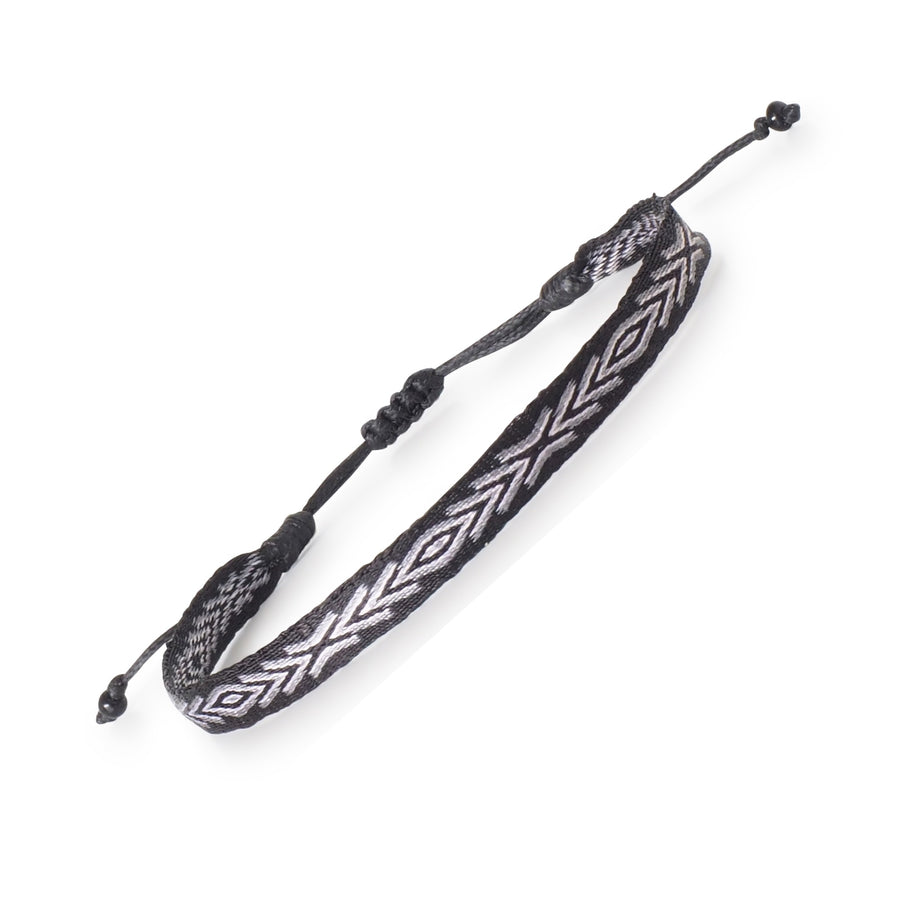 Handwoven black, grey, and white men's surfer bracelet handmade in Colombia

