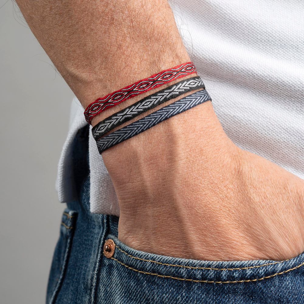 Handwoven men's surfer bracelet with a diamond pattern; waterproof and adjustable.