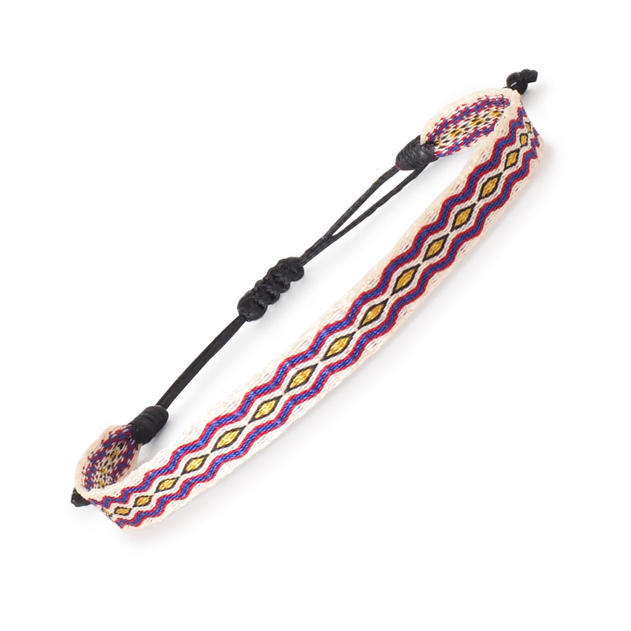 Handwoven beige, blue, and yellow surfer bracelet with diamond pattern and adjustable cord. Handmade by artisans in Colombia.