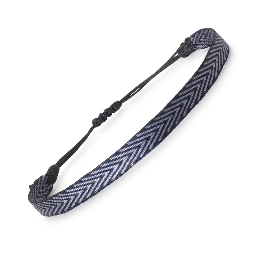 Handwoven men's surfer bracelet in navy and silver chevron pattern with adjustable cord. Boho style






