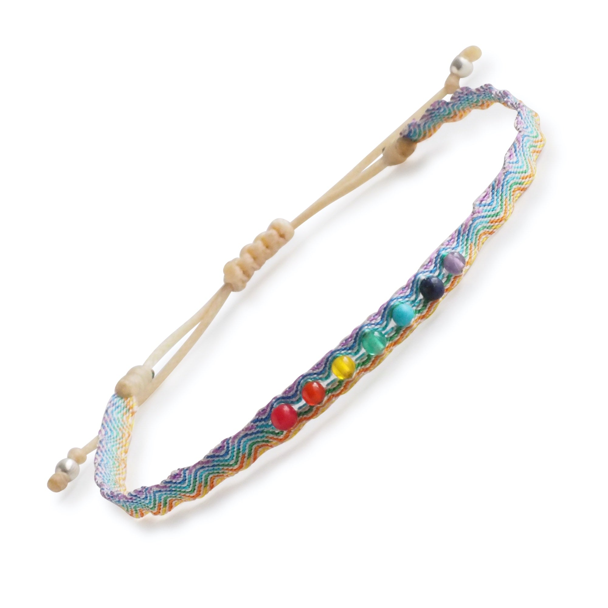 Egyptian Loom Harmony Chakra Bracelet light made with 40 polyester threads with 7 gemstones representing each chakra. Adjustable Bracelet