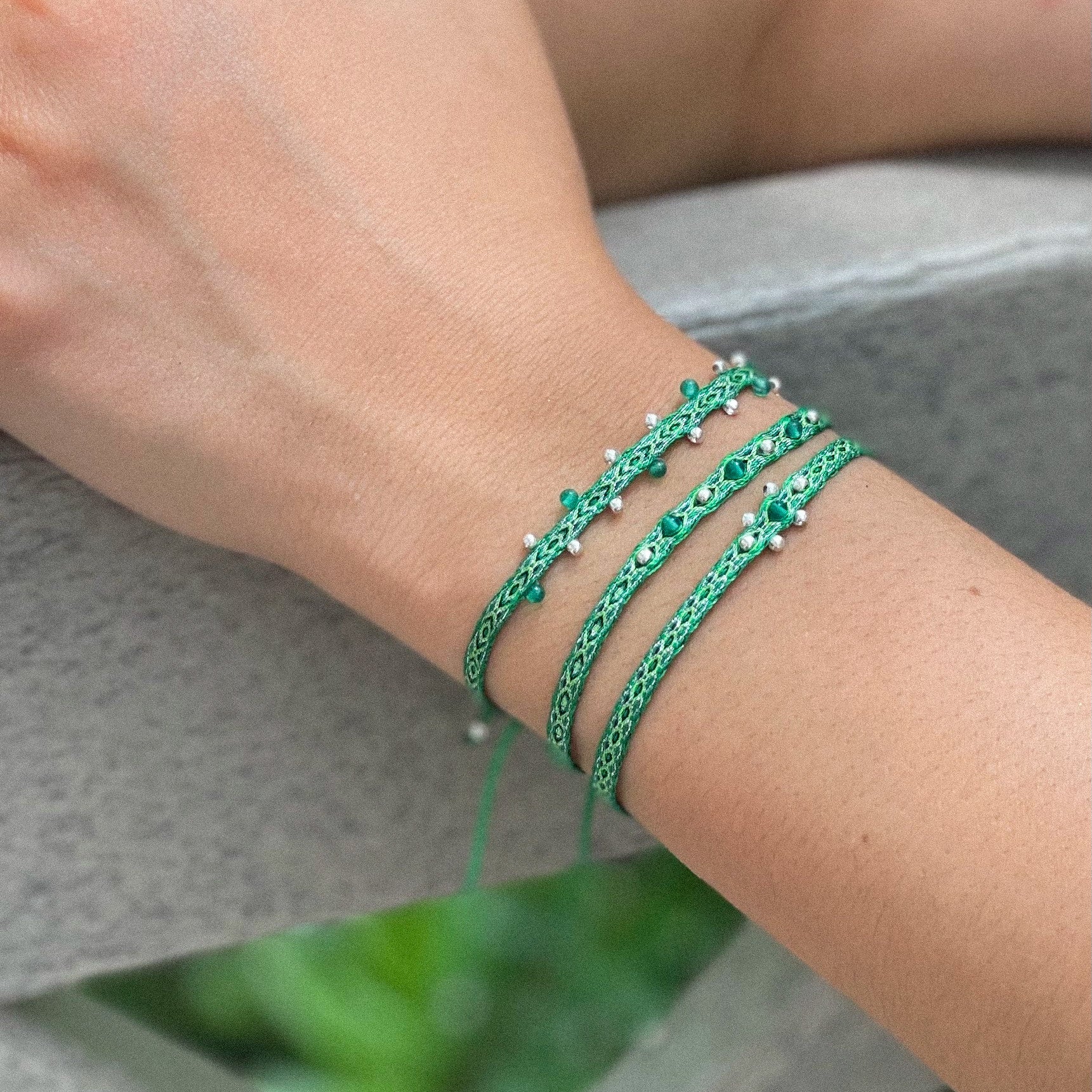 Egyptian Loom Bracelet Green Chakras Bracelet, with gemstones on model, 40 threads bracelet